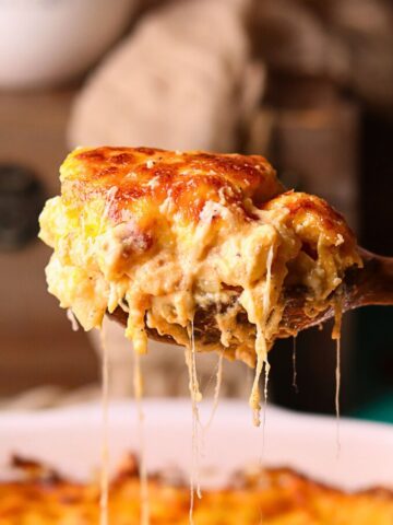 A serving of creamy southern baked mac & cheese on a serving spoon.