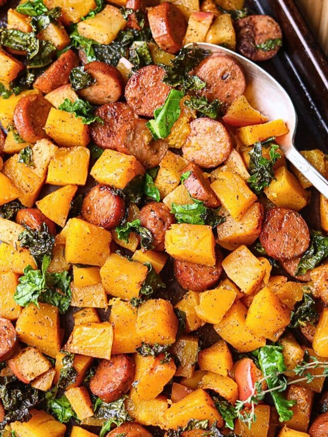 Chicken sausage and butternut squash sheet pan meal sitting on a table top.