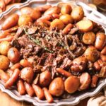 Ultimate Dutch oven pot roast with vegetables on a serving platter.