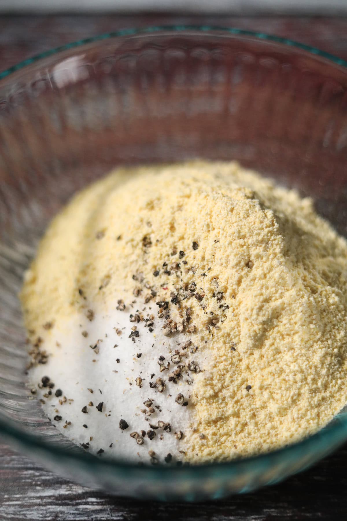 Dry ingredients for hot water cornbread in a mixing bowl.