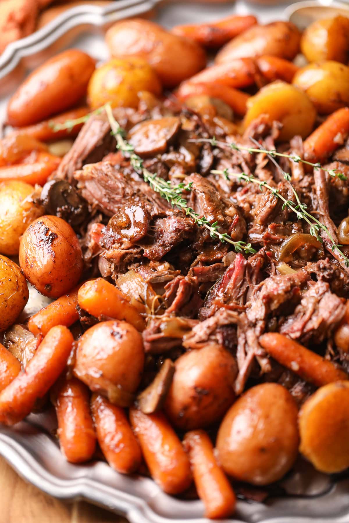 Ultimate Dutch oven pot roast with vegetables on a serving platter.