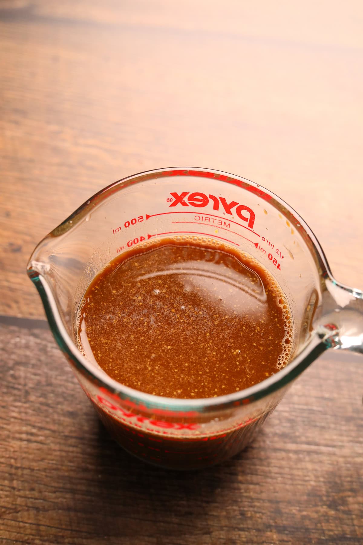  Balsamic sauce for Dutch oven pot roast in a measuring cup.