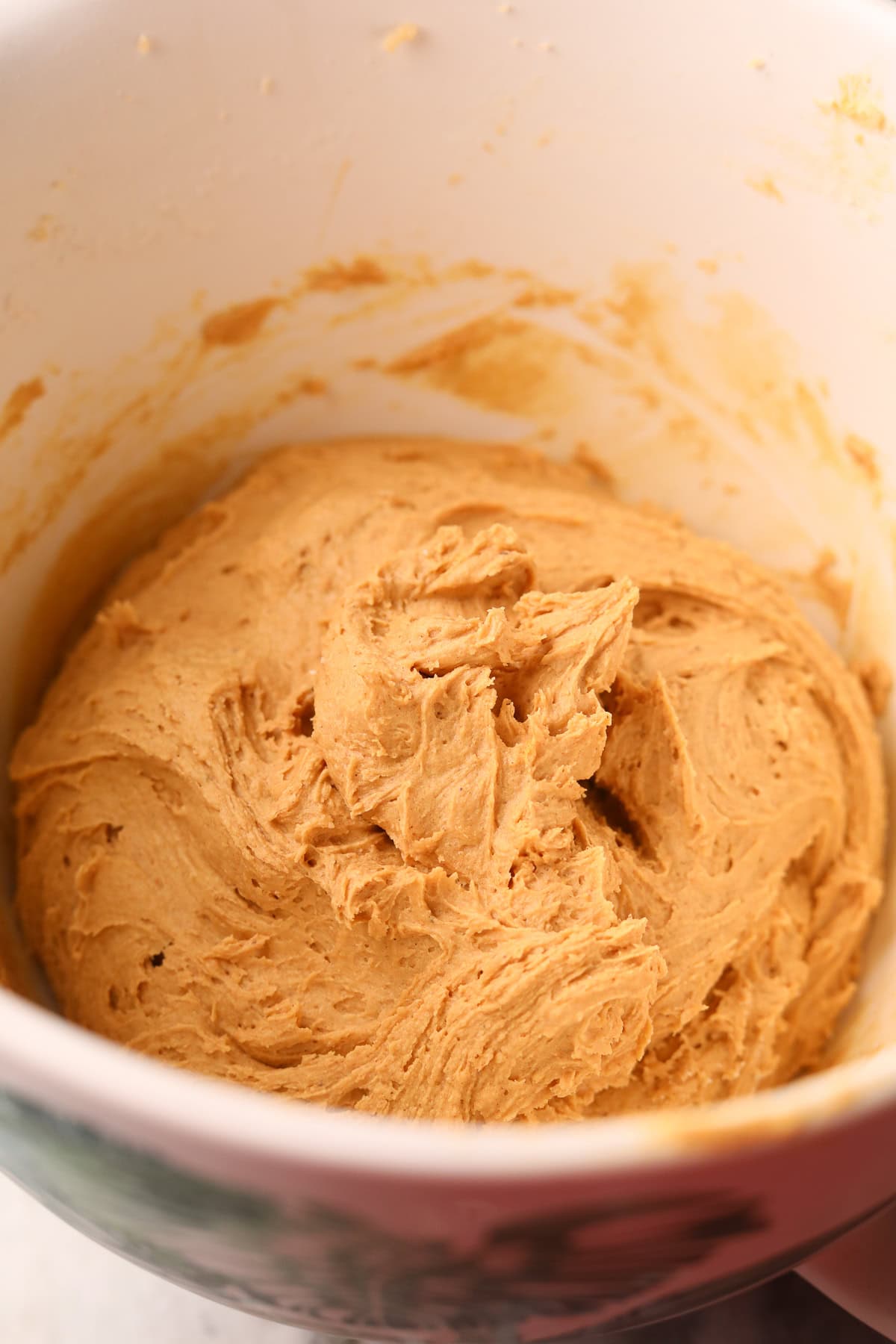 Finished apple butter, molasses snicker doodles dough in a stand mixer bowl.