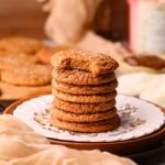 A stack of molasses apple butter snickerdoodles on a dessert plate.