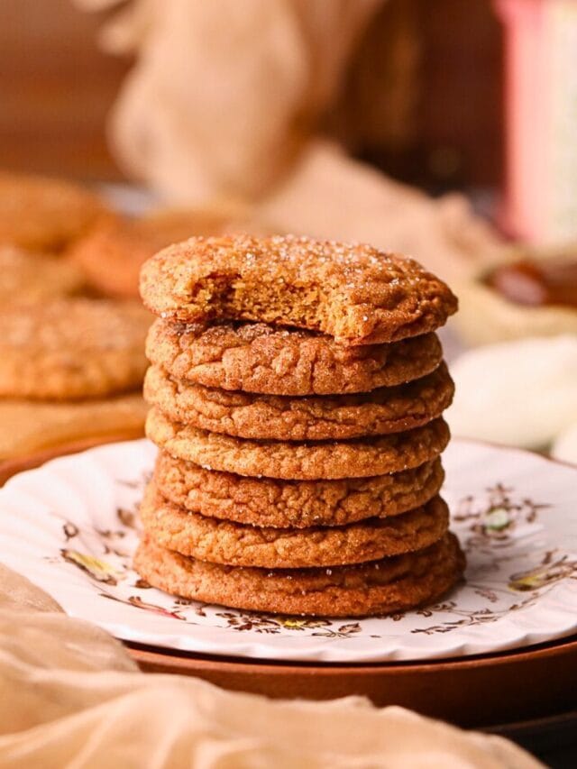 A stack of molasses apple butter snickerdoodles on a dessert plate.