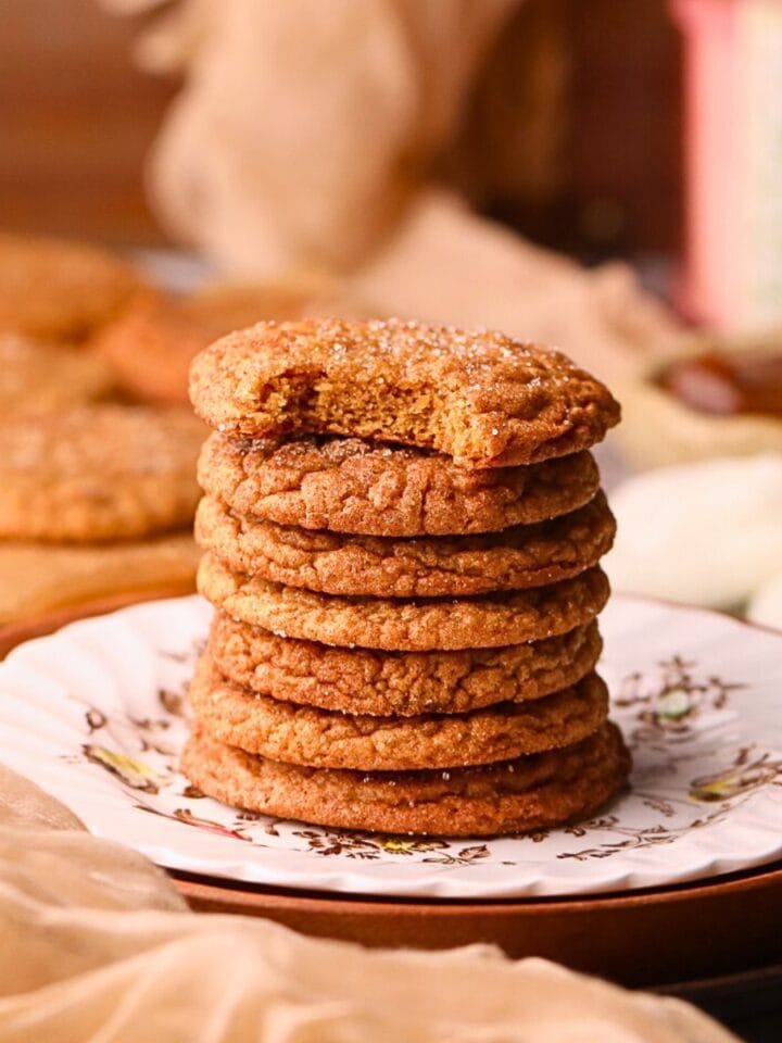 A stack of molasses apple butter snickerdoodles on a dessert plate.