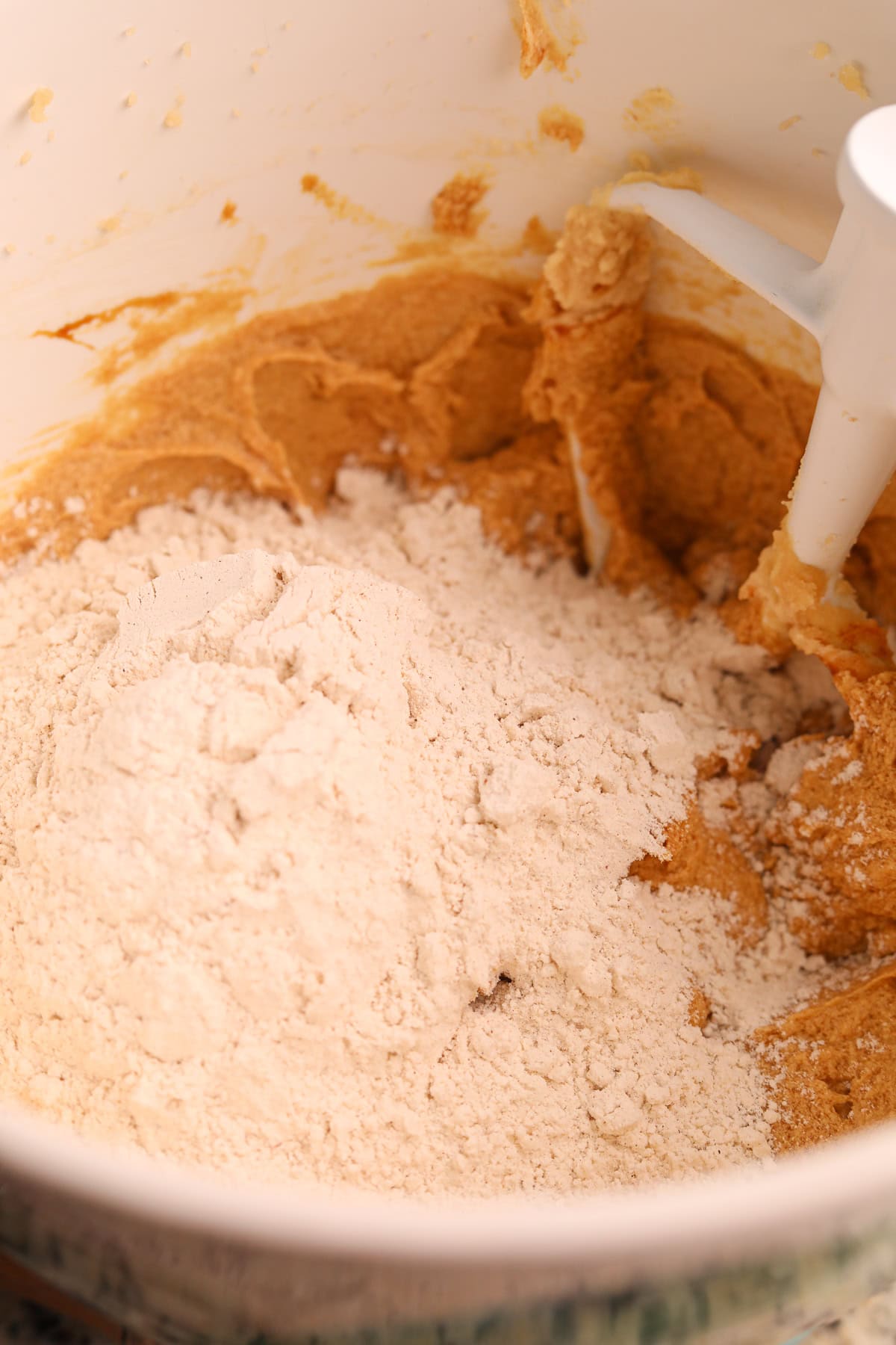 Dry ingredients added to wet ingredients for apple butter molasses snickerdoodles.