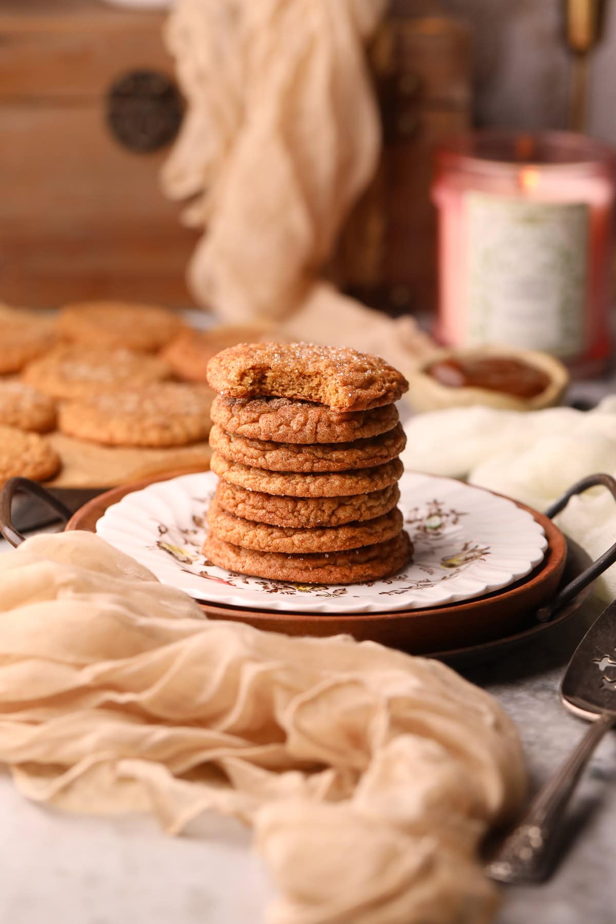 A stack of molasses apple butter snickerdoodles on a dessert plate.
