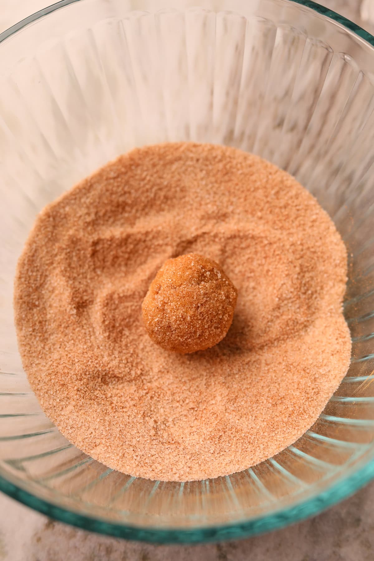 Balls of apple butter, molasses snickerdoodles, cookie dough coated in cinnamon and sugar.