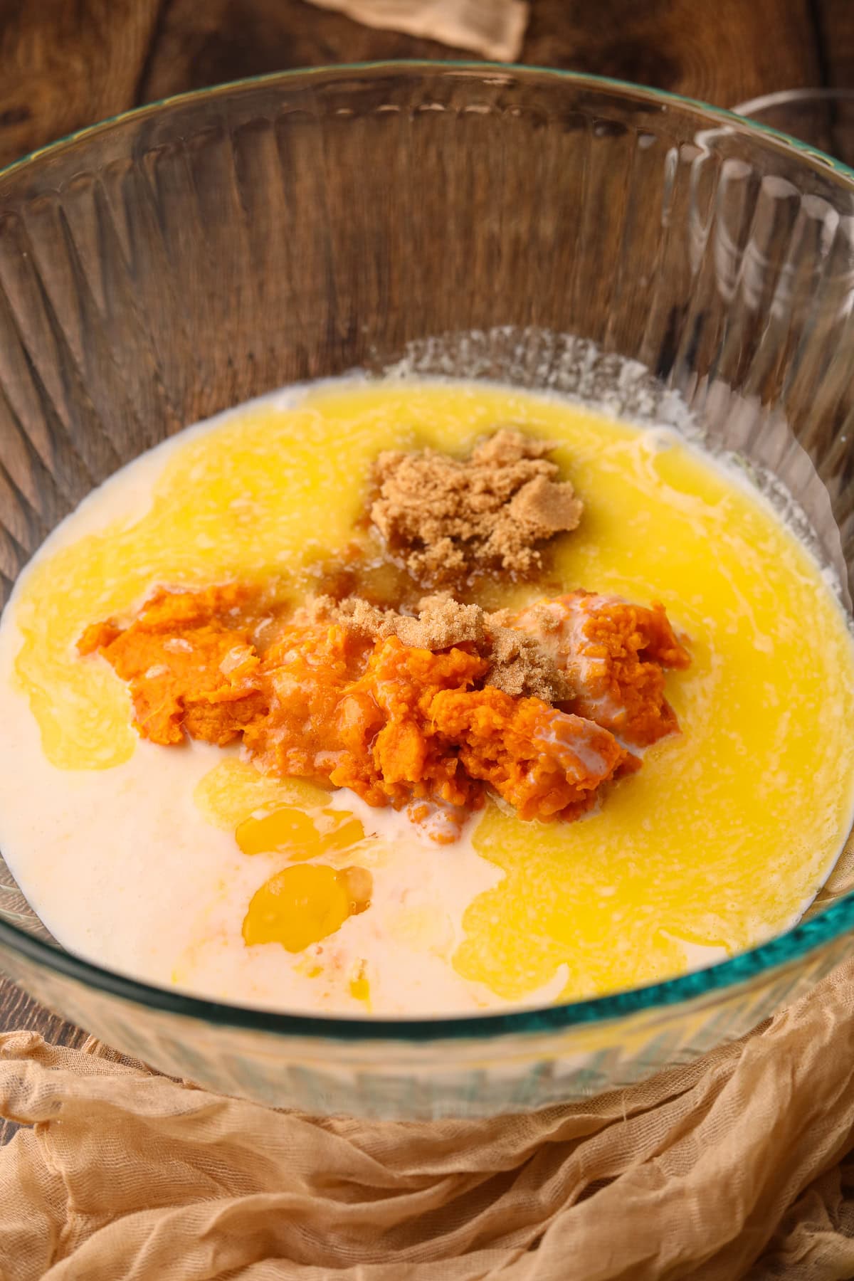 What ingredients for sweet potato waffles in a mixing bowl.