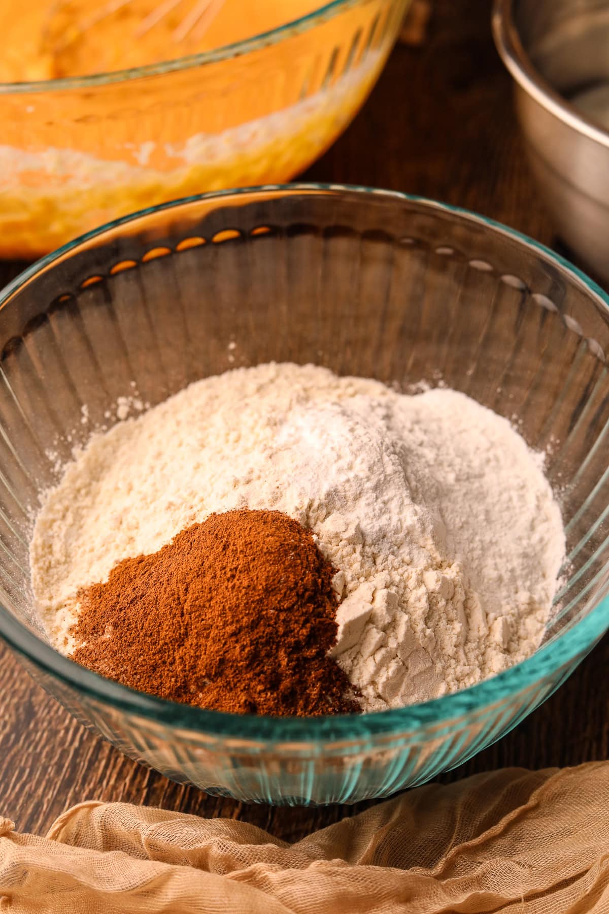 Dry ingredients for sweet potato waffles in a large mixing bowl.