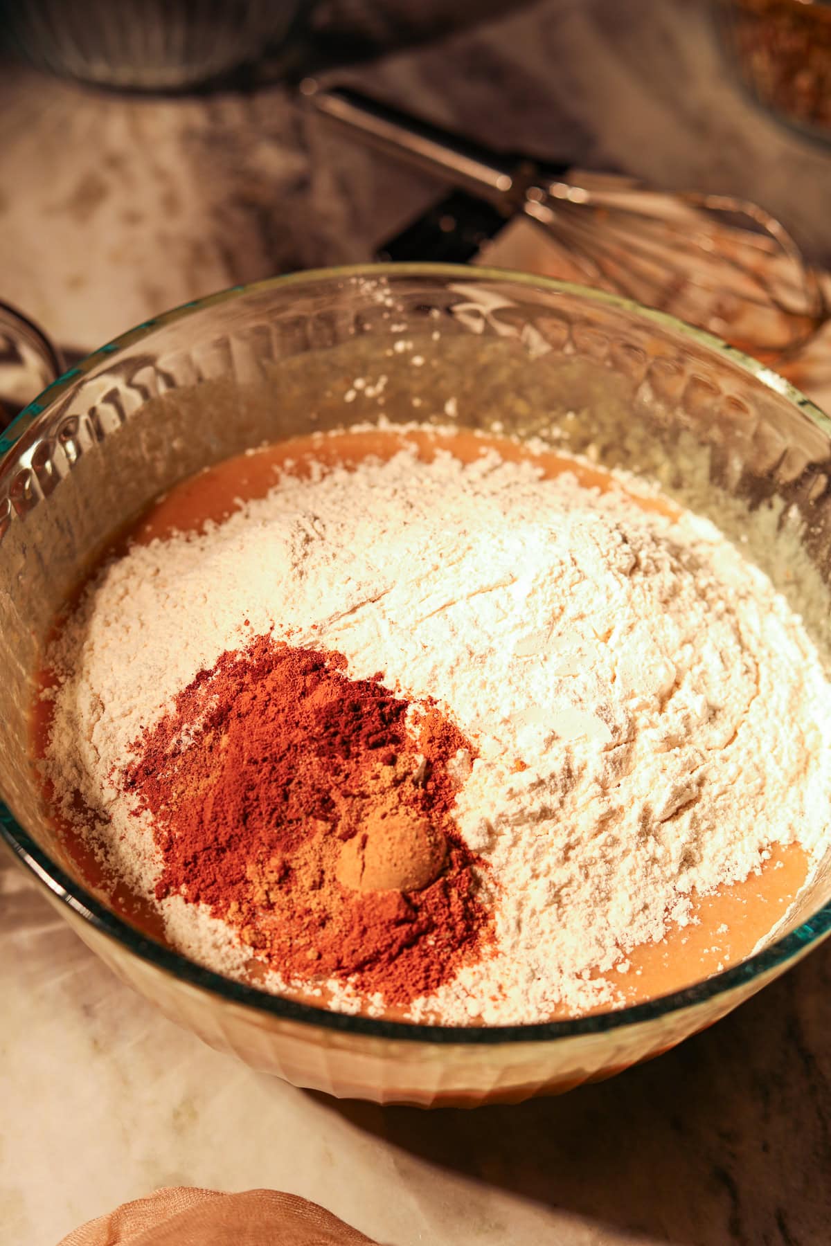 Apple butter, banana, bread, wet, and dry ingredients in a mixing bowl.