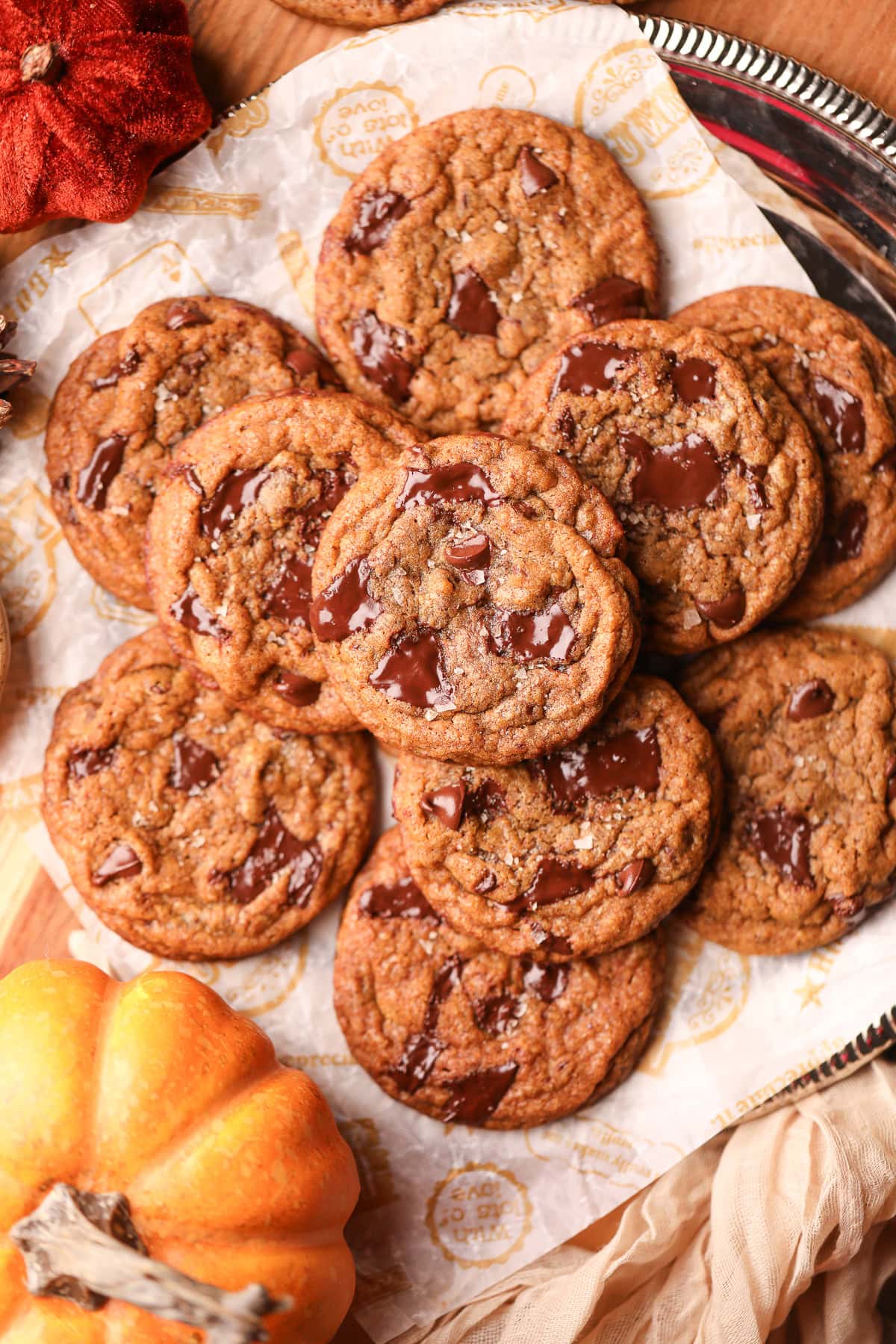 Brown butter, pumpkin chocolate chip cookies on a platter.