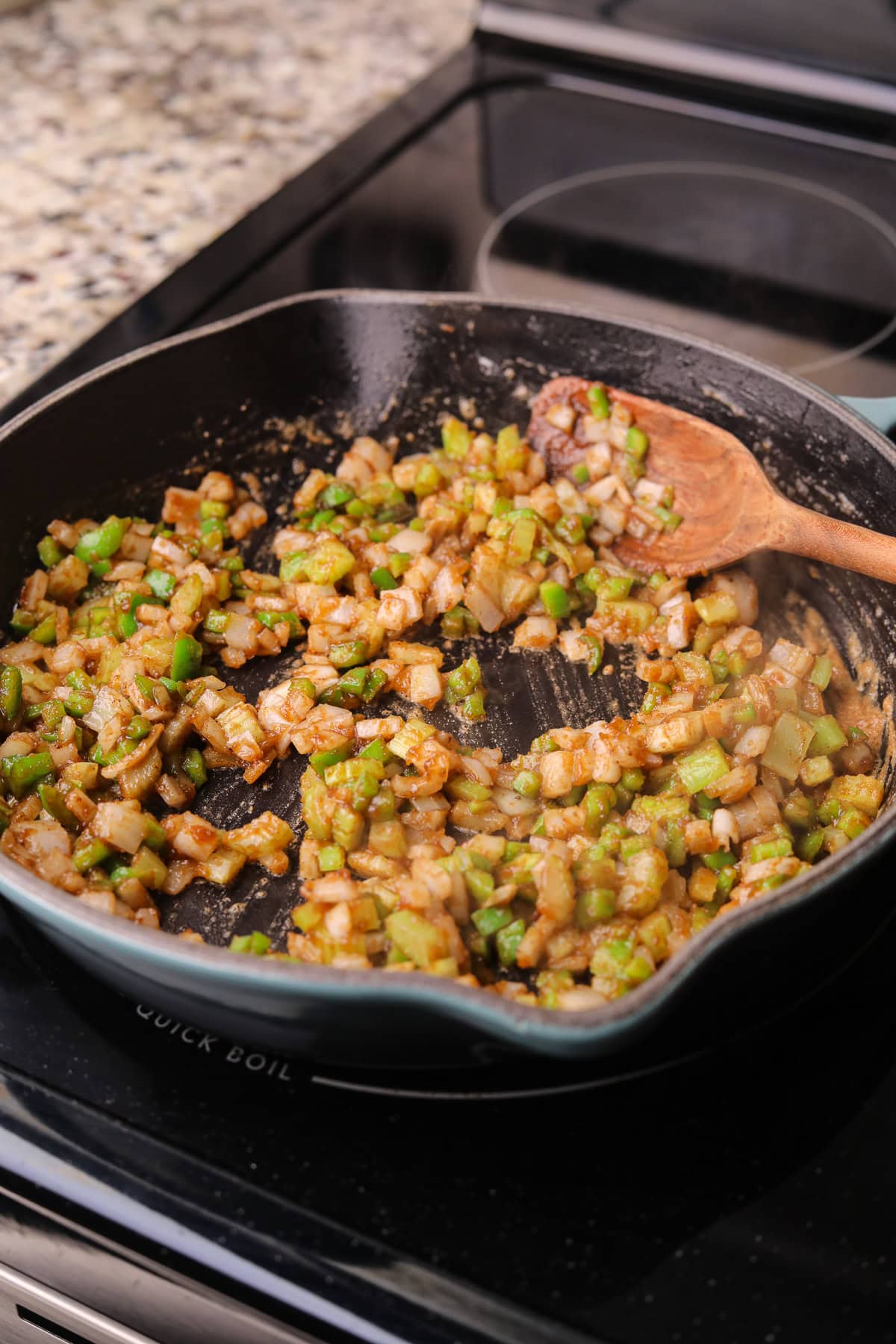 Veggies cooking in roux for catfish etouffee pot pie.