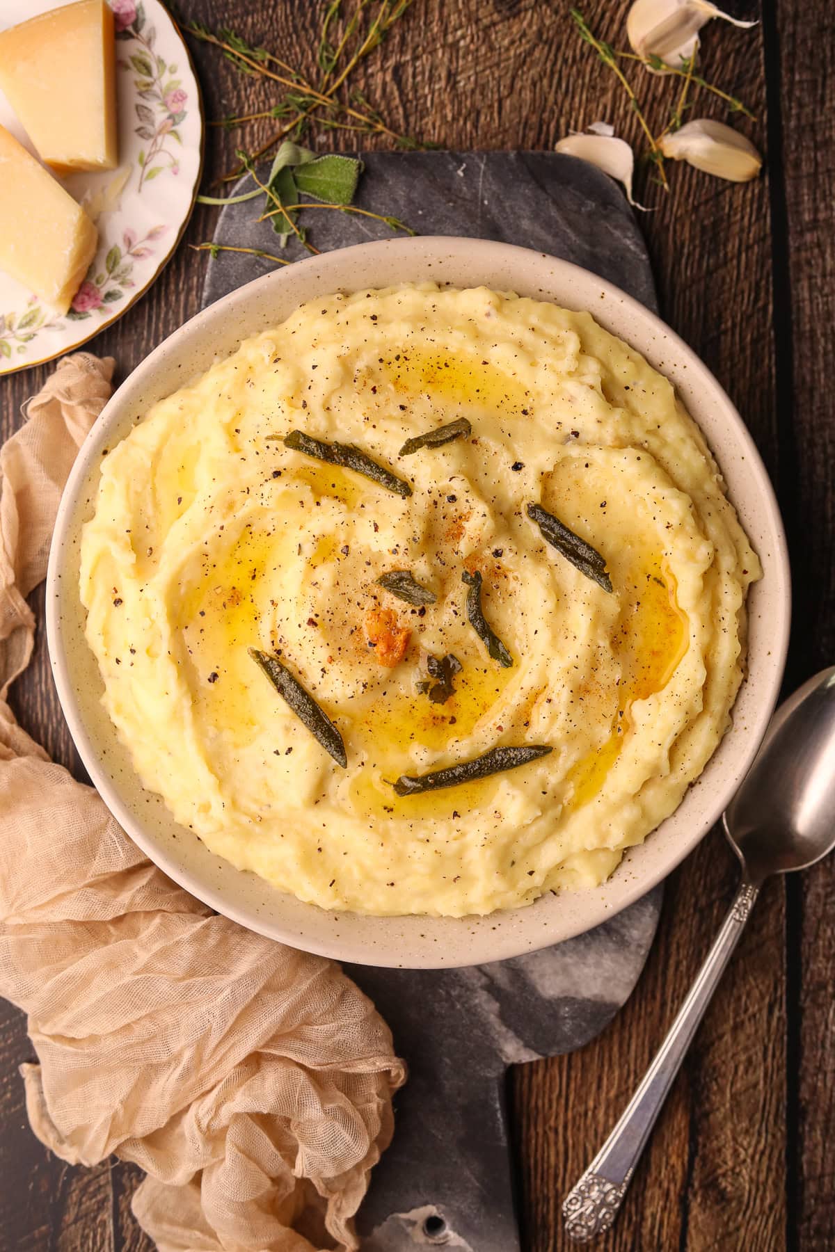 Brown butter, sage, mashed potatoes in a serving bowl.