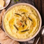 Brown butter, sage, mashed potatoes in a serving bowl.