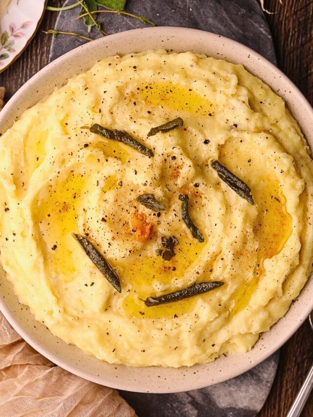 Brown butter, sage, mashed potatoes in a serving bowl.