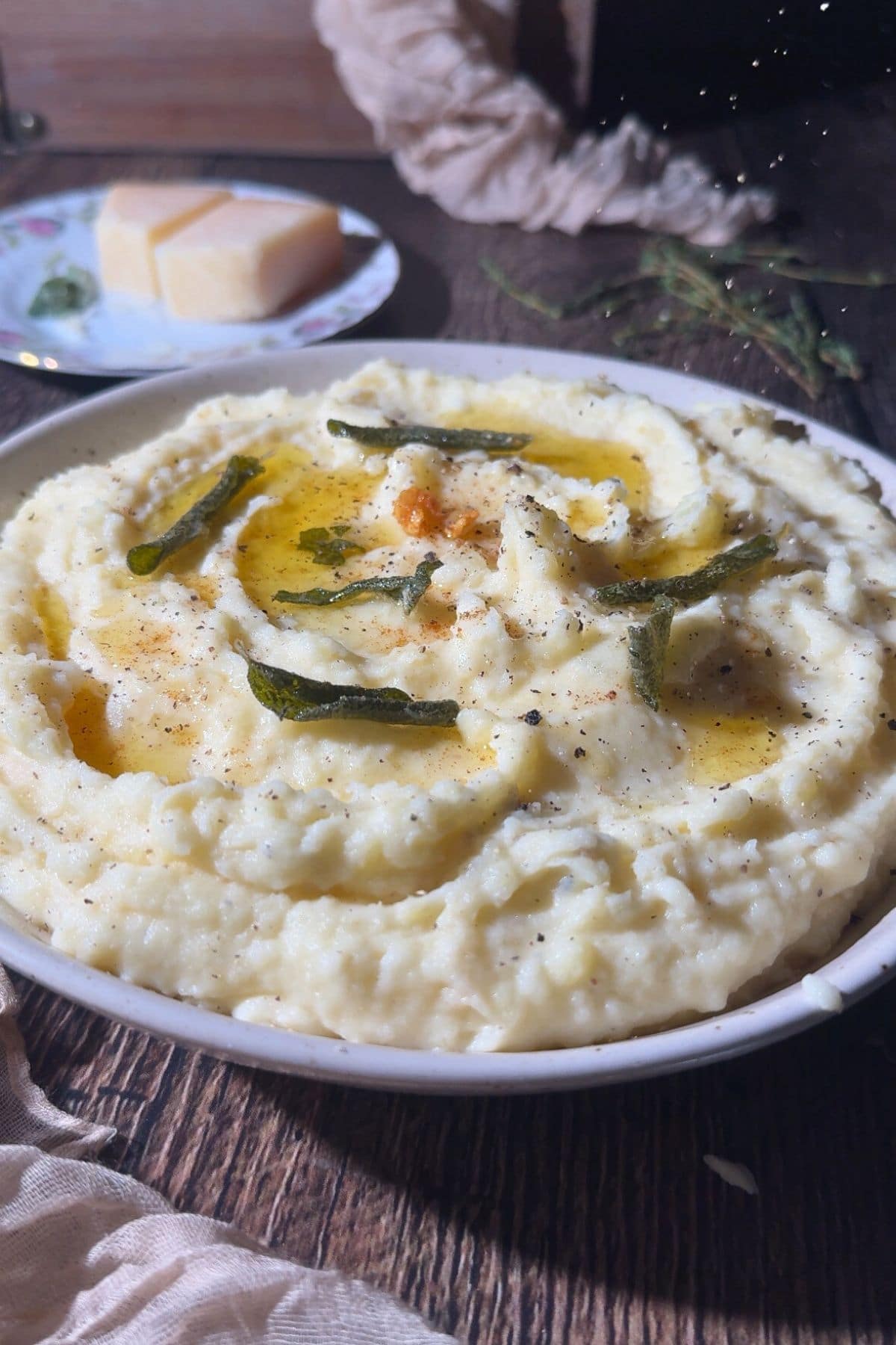 Brown butter, sage, mashed potatoes in a serving bowl.