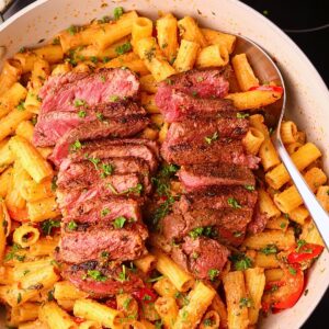 Cowboy butter steak rigatoni in a skillet.