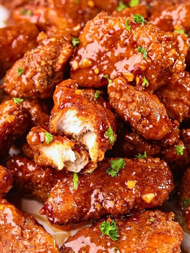 Crispy hot honey, garlic chicken bites on a plate.
