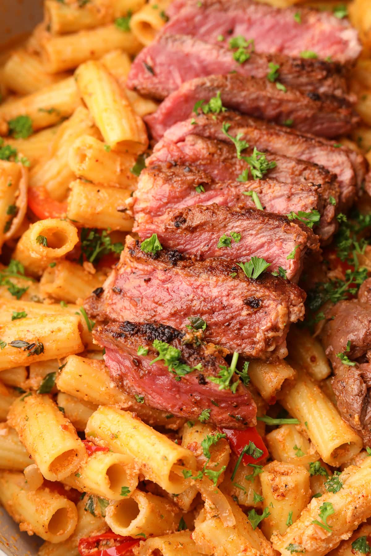 Cowboy butter steak rigatoni in a skillet.