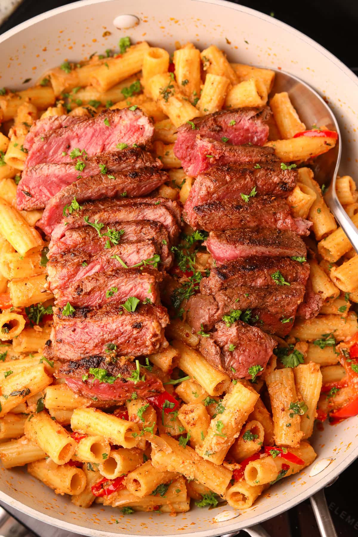 Cowboy butter steak rigatoni in a skillet. 