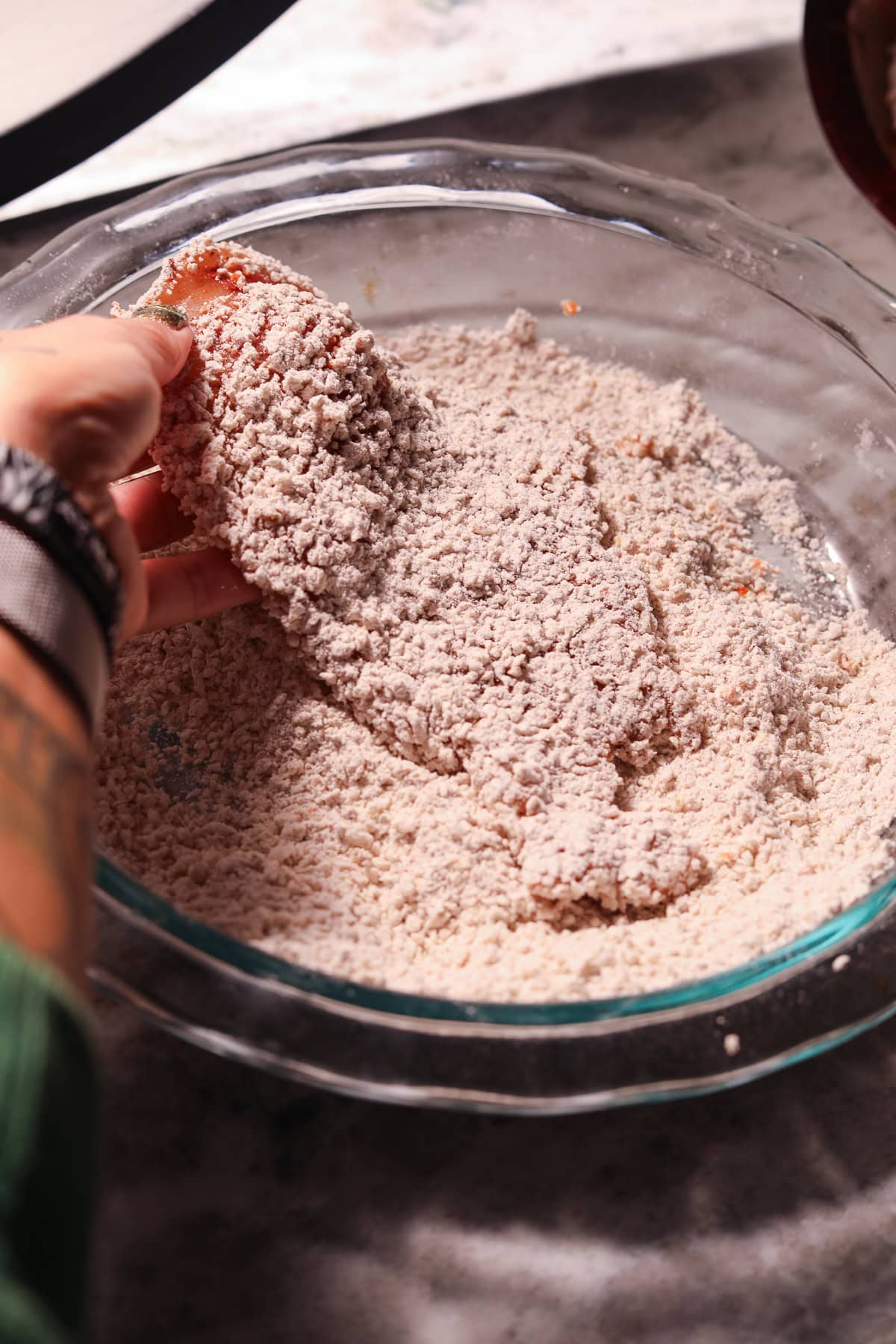 Thin chicken breast coated in flour and Panko breading.