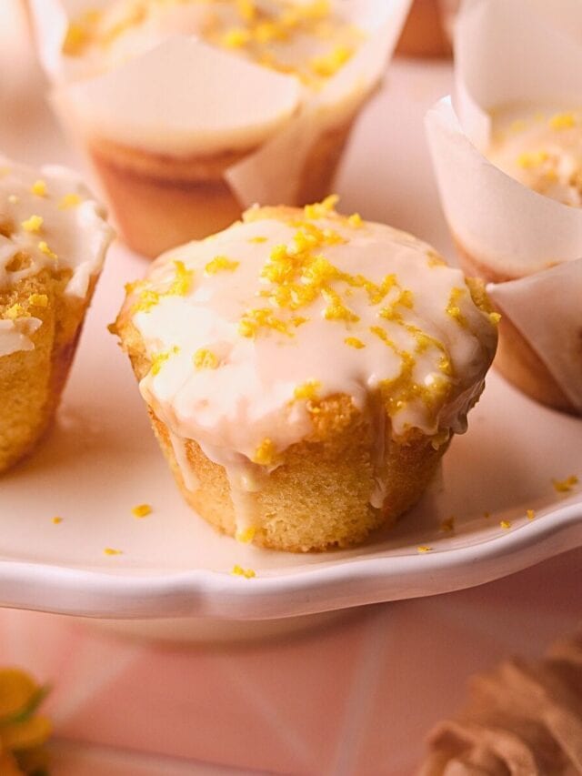 Lemon cream cheese muffins on a serving platter.