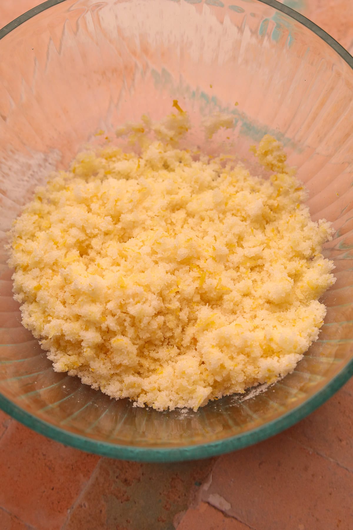 Lemon infused sugar in a mixing bowl. 