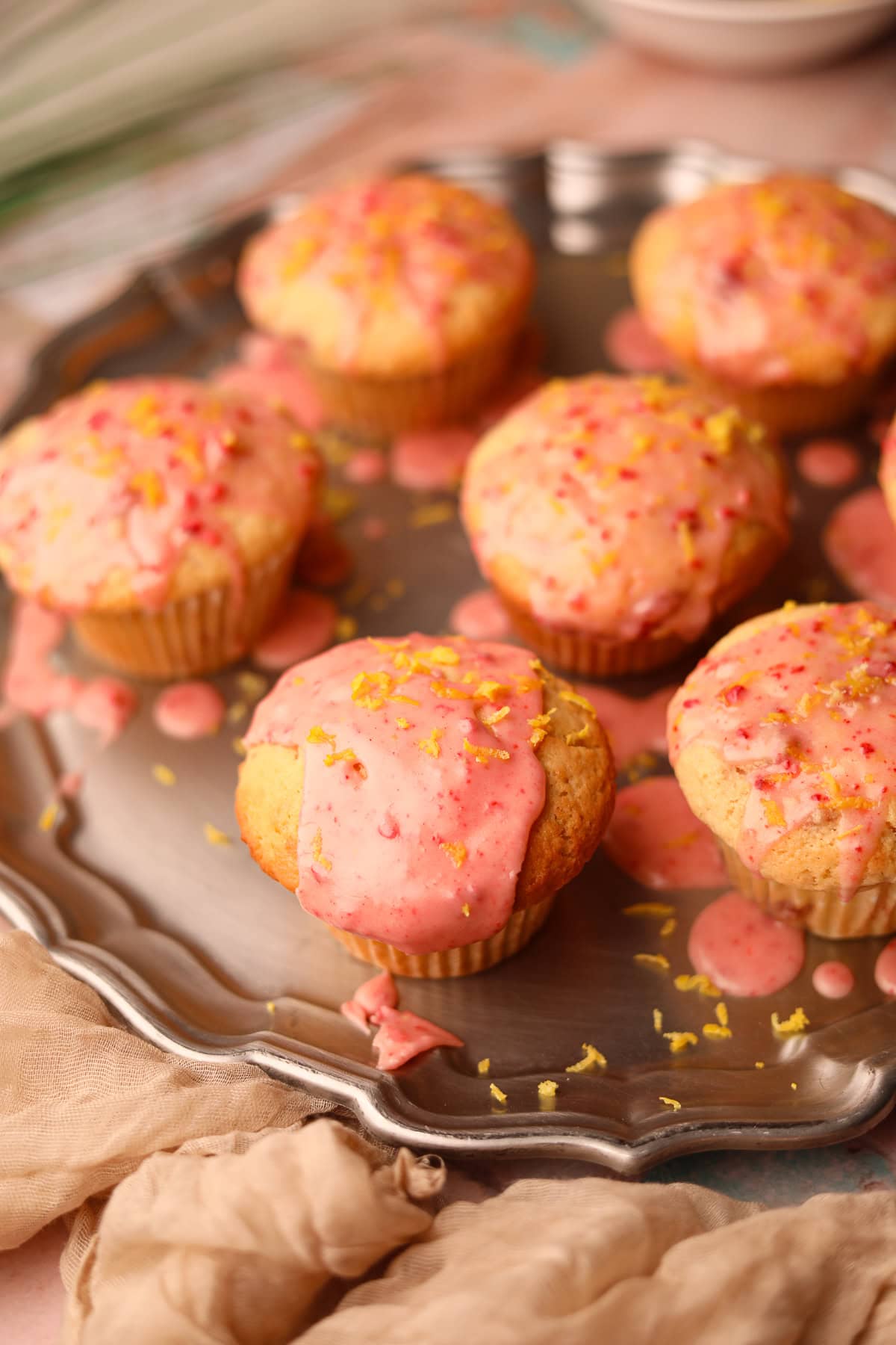 Strawberry lemonade, muffins on a silver platter.