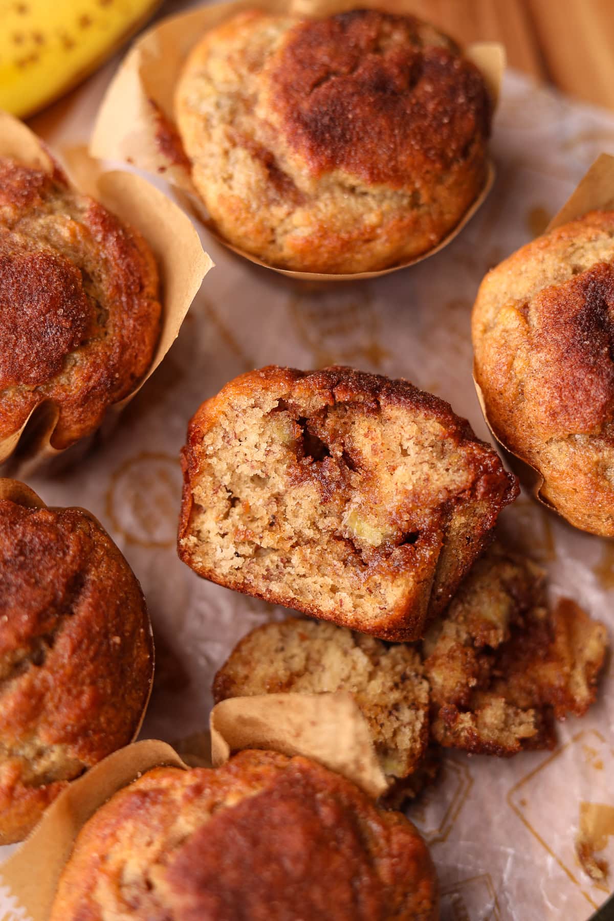 Close up of cinnamon swirl, banana muffin, broken open to show detail.