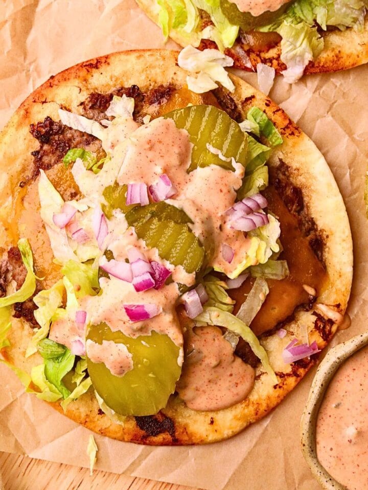 Smashburger tacos on a wooden cutting board.