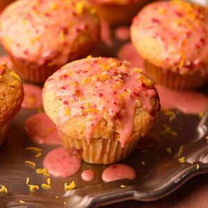 Strawberry lemonade, muffins on a silver platter.