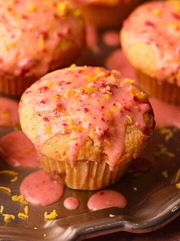Strawberry lemonade, muffins on a silver platter.