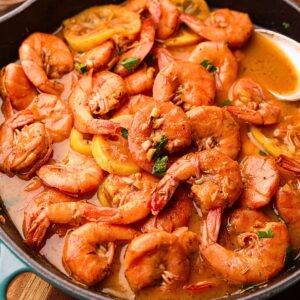New Orleans BBQ shrimp in a skillet.
