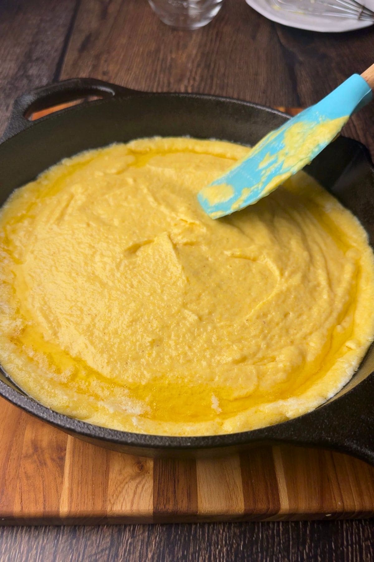 Southern cast-iron cornbread batter in a cast-iron skillet.