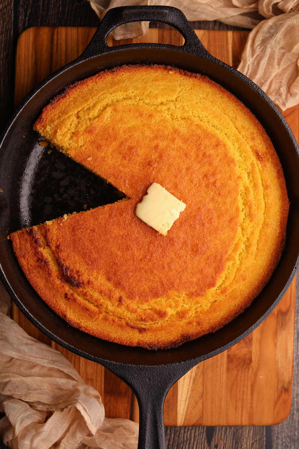 Southern cast-iron cornbread sliced in a skillet.
