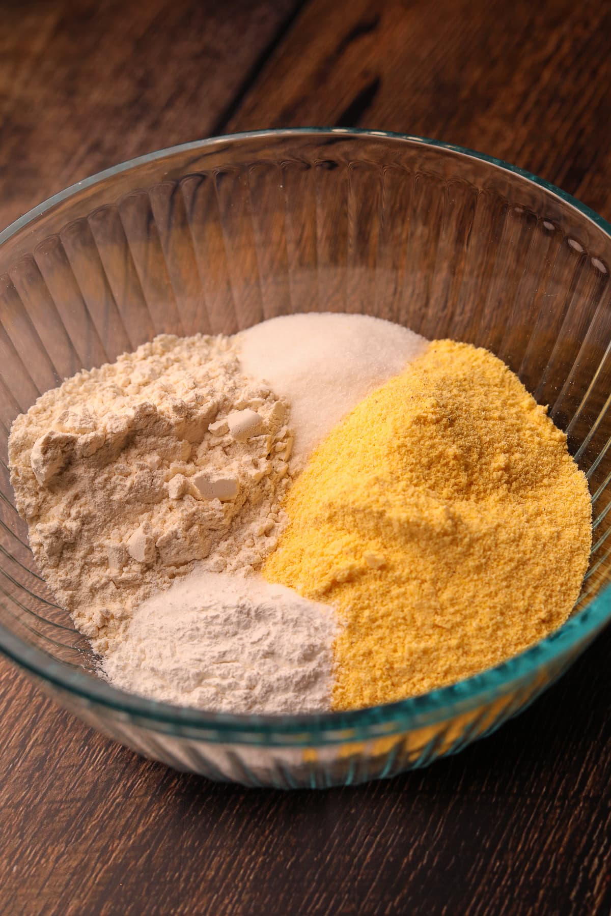Dry ingredients for southern cast-iron cornbread, and a mixing bowl.