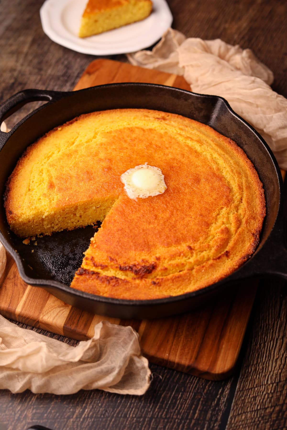 Southern cast-iron cornbread sliced in a skillet.