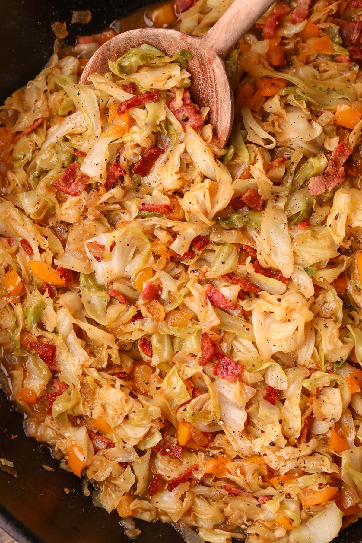 Close up photo of southern fried cabbage in a skillet.