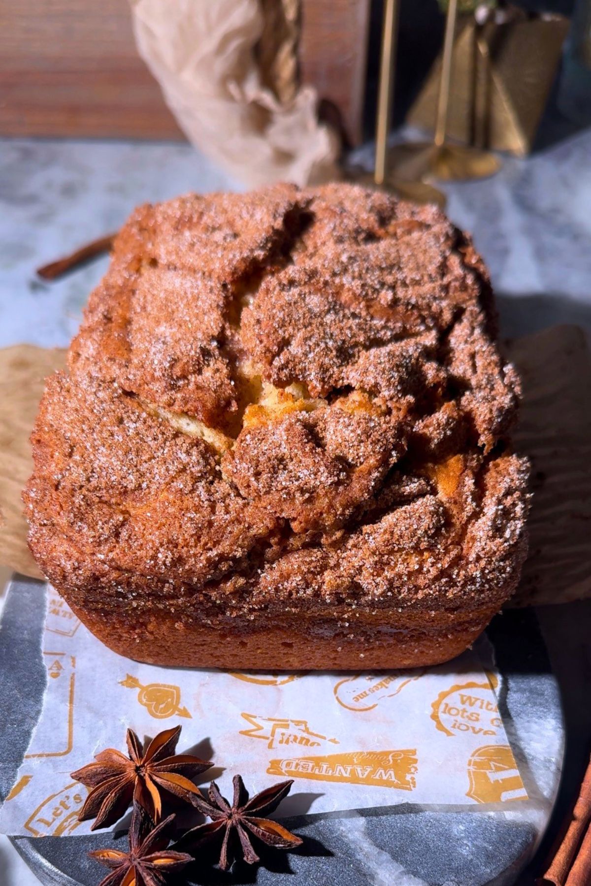 Freshly baked cinnamon roll quick bread on a serving board.